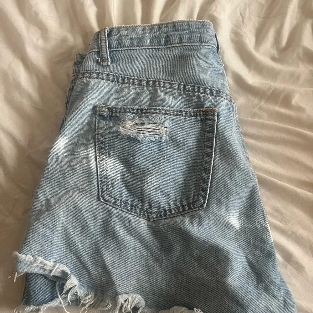 Distressed Light Blue Denim Shorts - Women